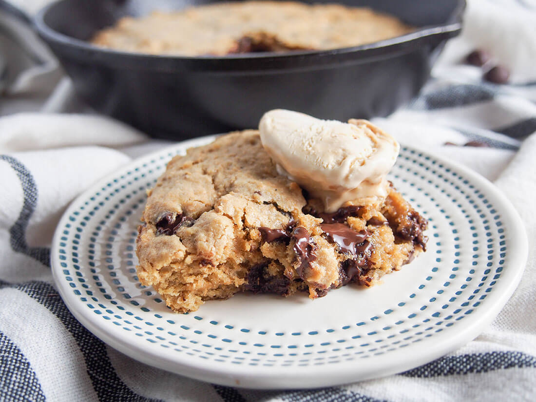 Piece of oatmeal chocolate chip skillet cookie