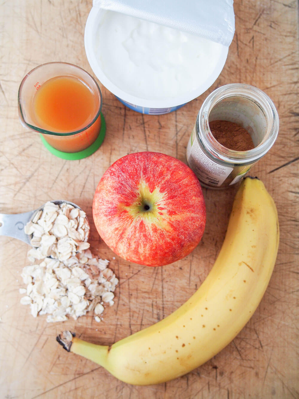 apple banana smoothie ingredients smoothie ingredients laid out on chopping board