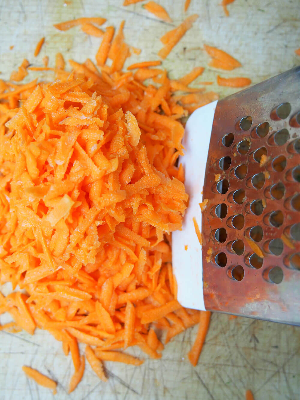coarsely grating carrots