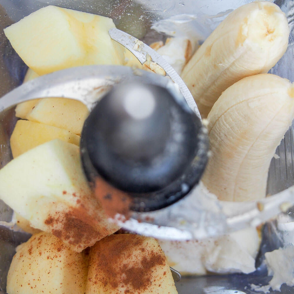 making apple banana smoothie - ingredients in blender ingredients in blender ready to mix