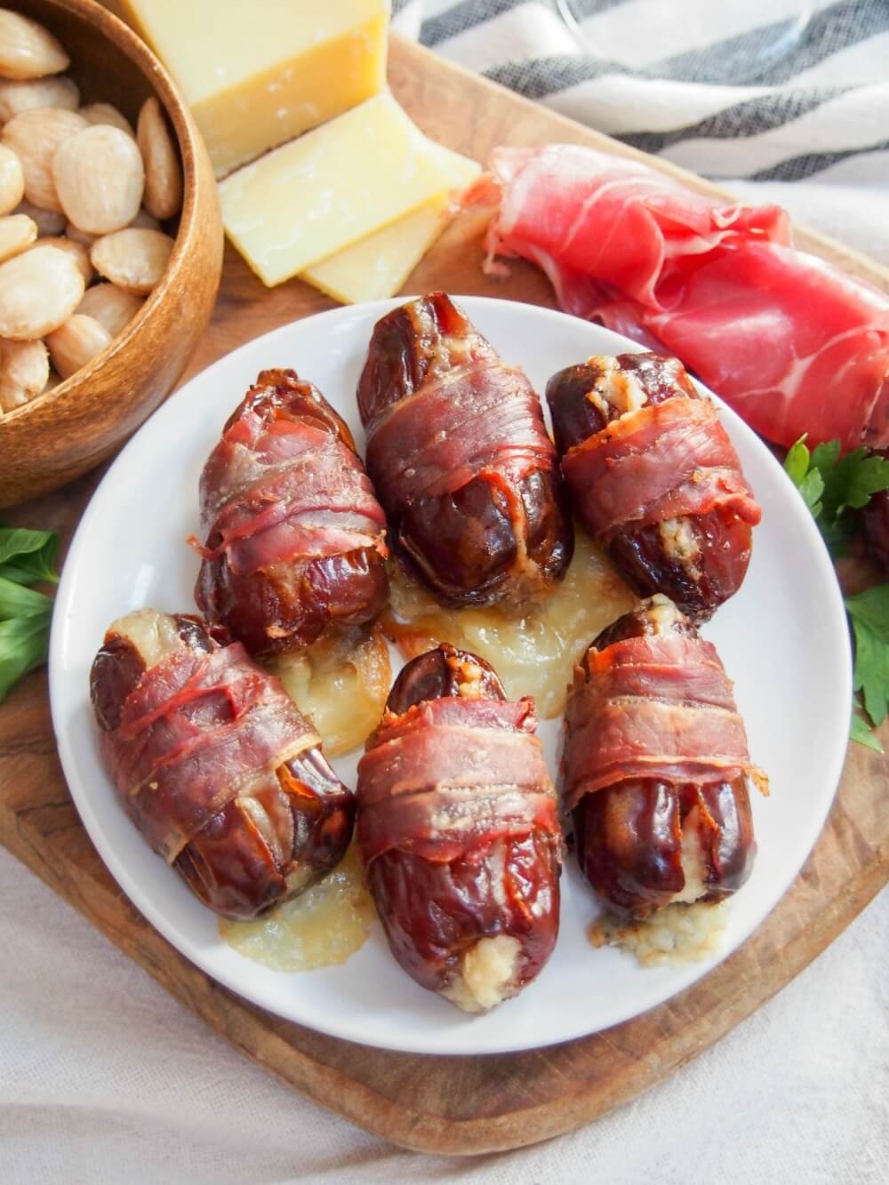 prosciutto wrapped dates on plate from above