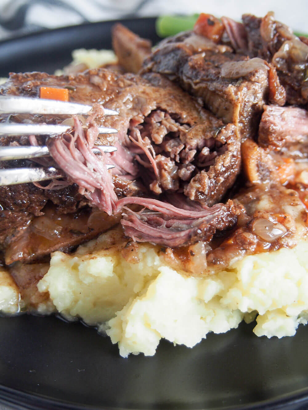fork tender slow cooker short ribs fork tender slow cooker short ribs - pulling apart meat with fork