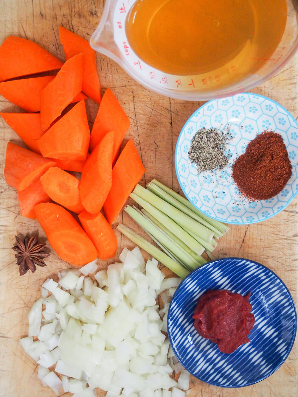 some of ingredients for bo kho Vietnamese beef stew some of ingredients for bo kho Vietnamese beef stew in dishes and on chopping board