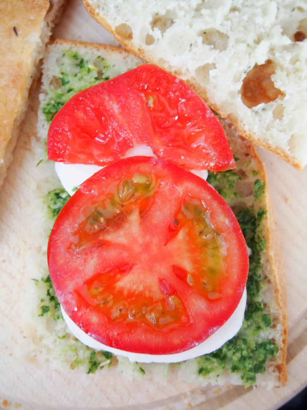 adding fillings to sandwich - tomato on top
