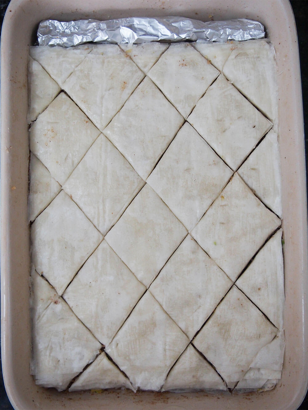 baklava scored and ready to bake
