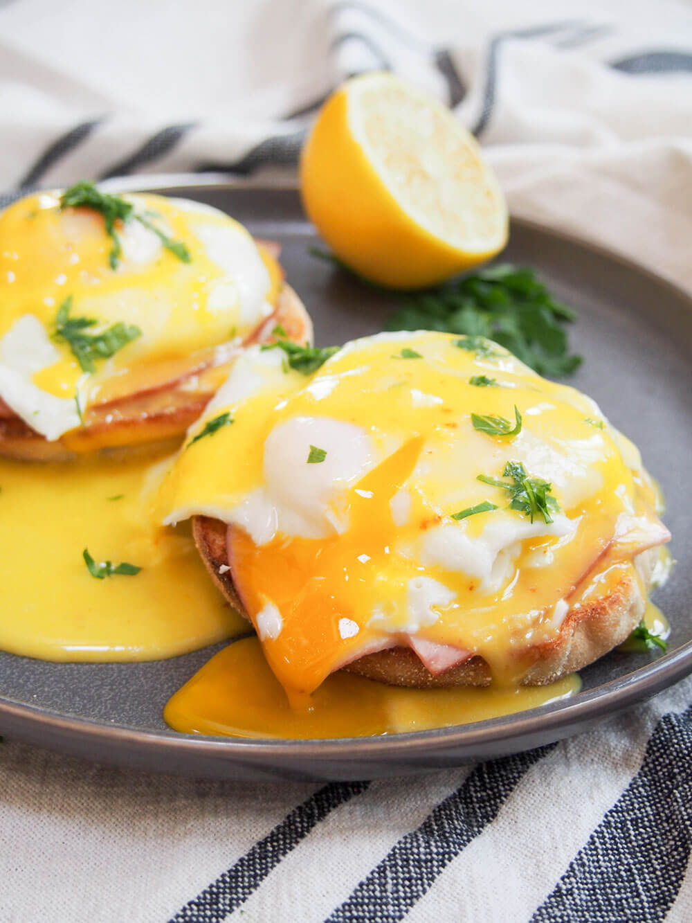 eggs Benedict with yolk cut and oozing