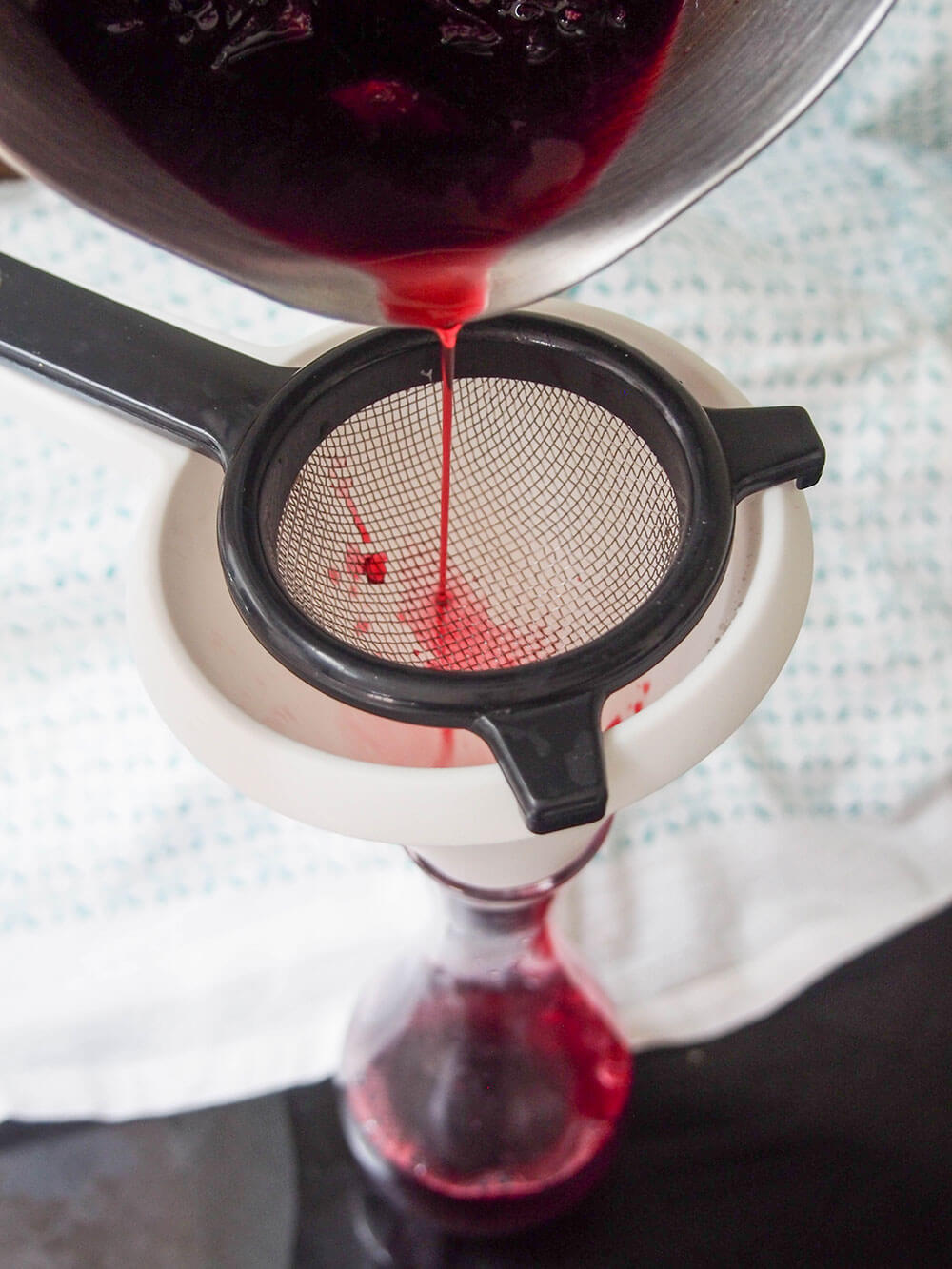 straining concentrate for Agua de jamaica - hibiscus tea