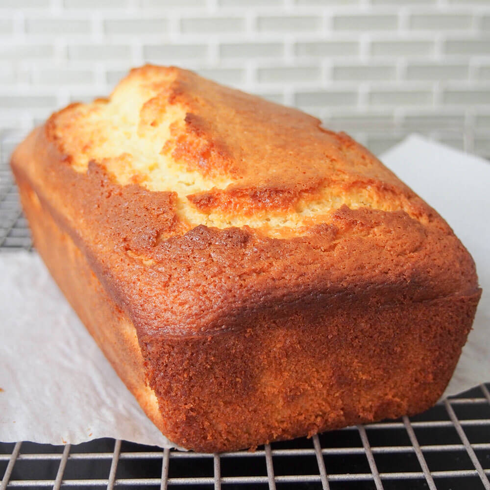 French lemon yogurt cake cooling on rack