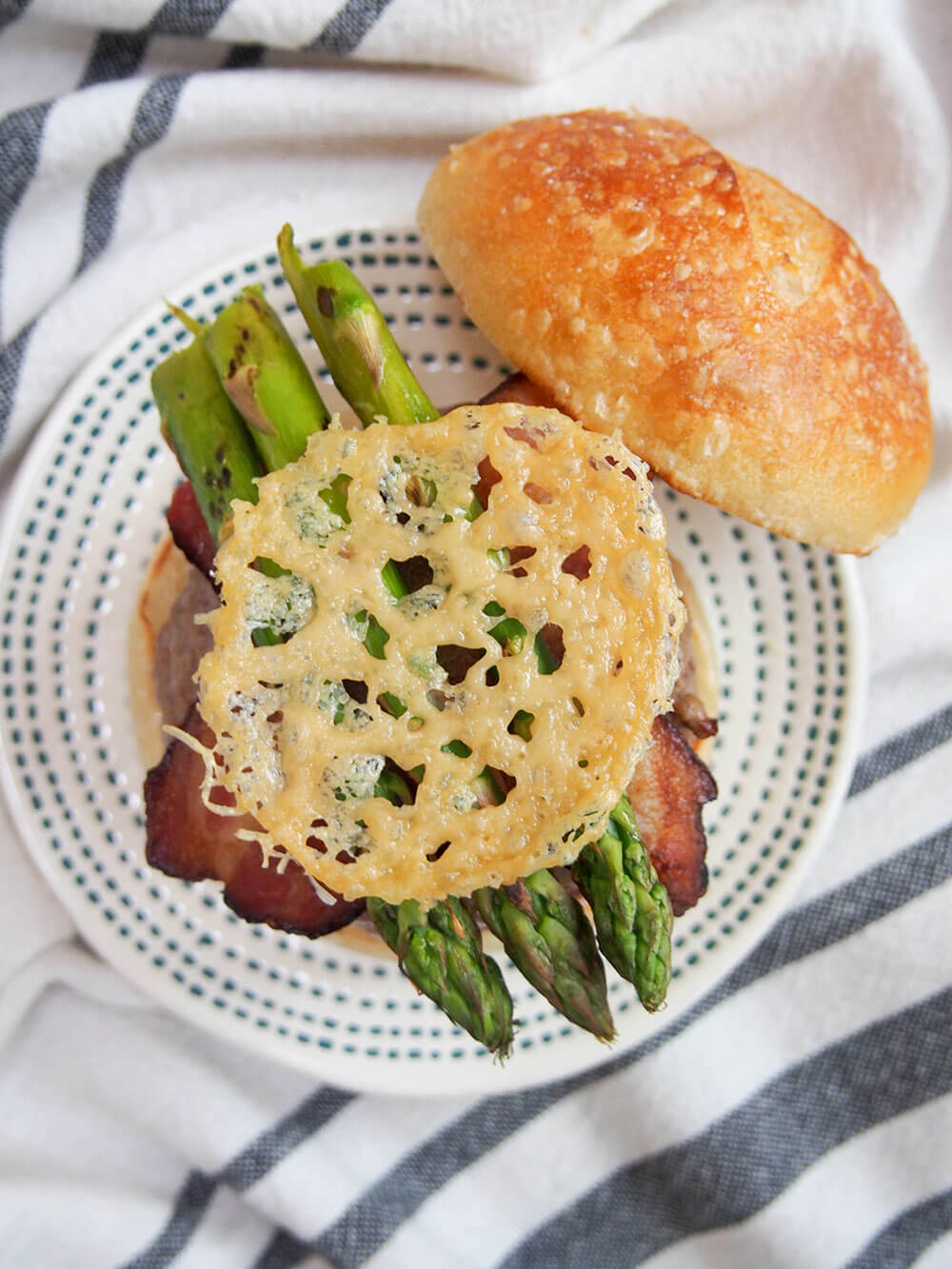 Asparagus parmesan burger with parmesan crisps - overhead shot with parmesan crisp sitting on top