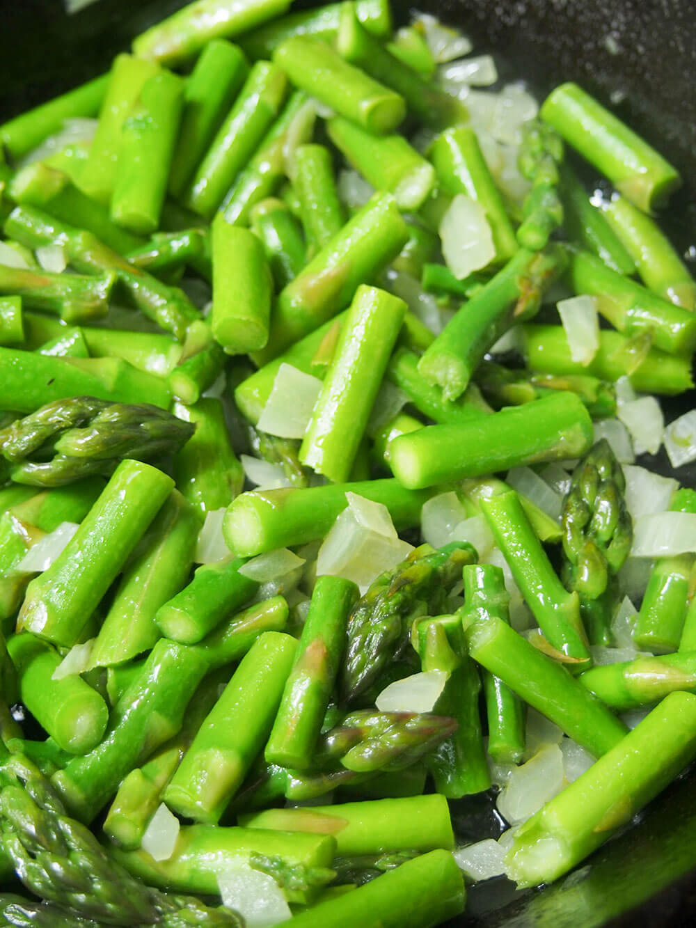 cooking asparagus and onion for asparagus frittata