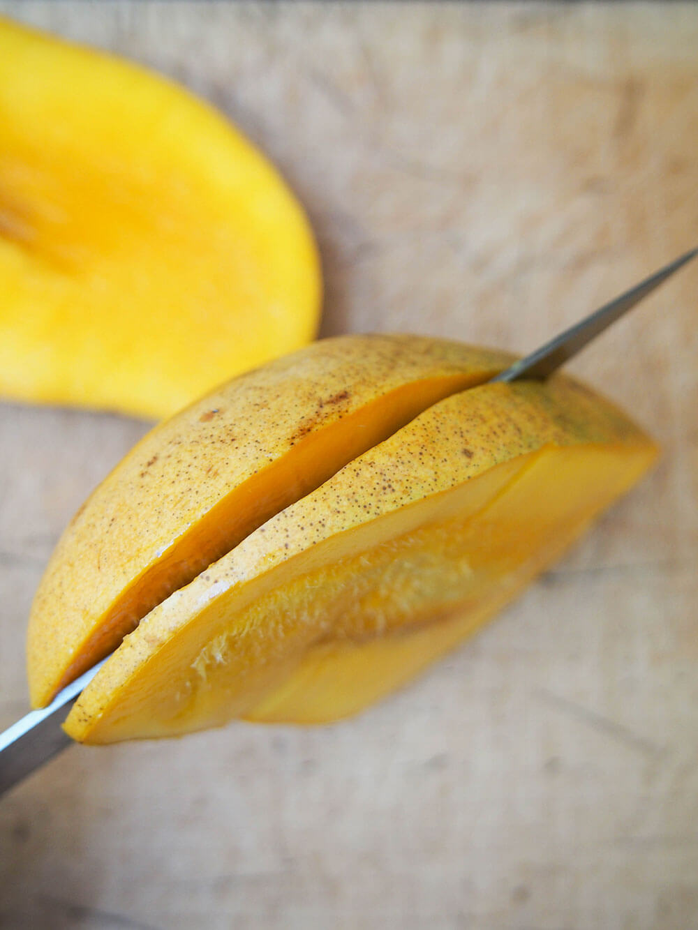 cutting mango from stone for mango lassi