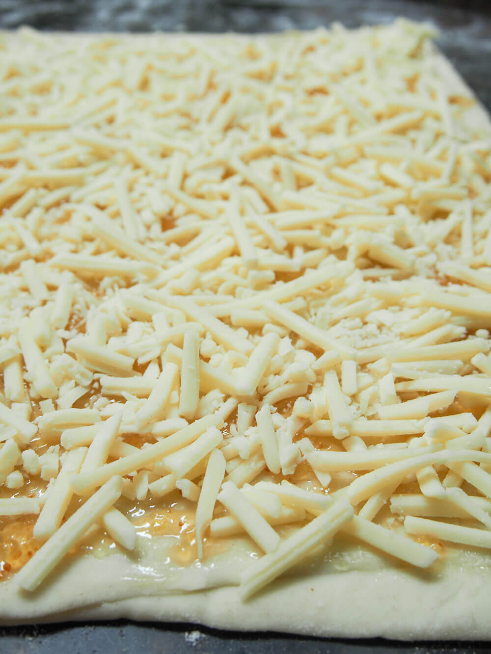 adding cheese filling