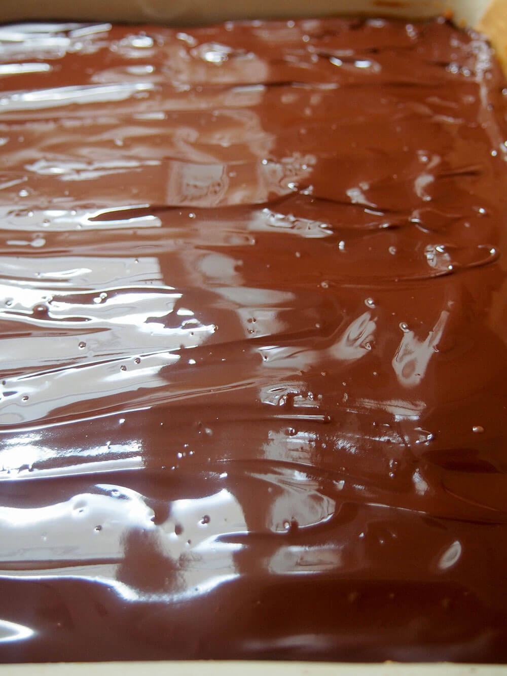 melted chocolate on Millionaire's shortbread (caramel shortbread)