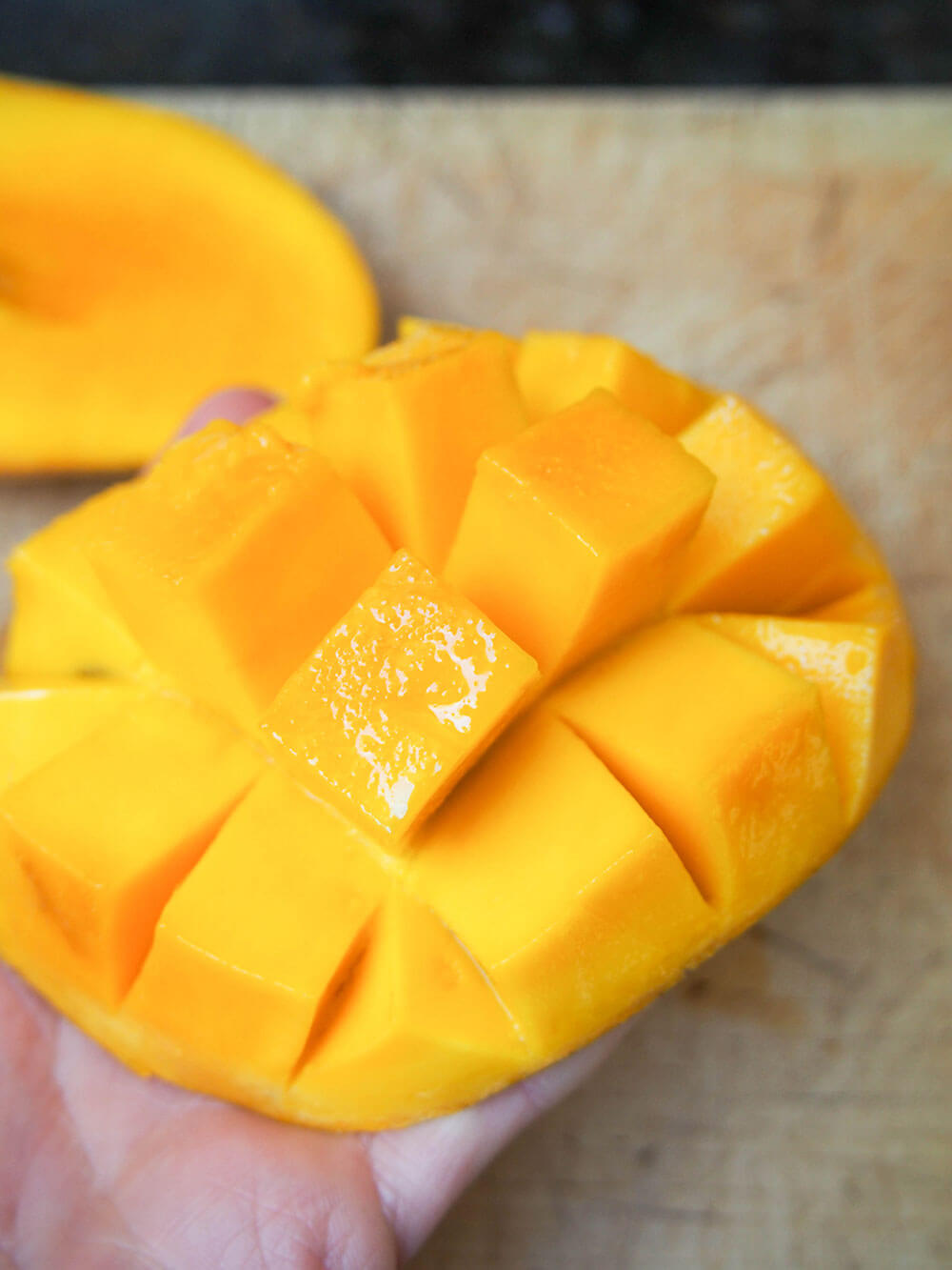 popping open mango for mango lassi
