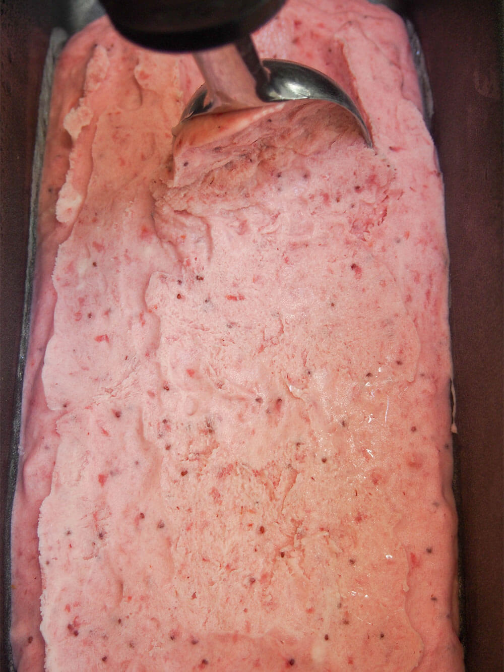 scooping ice cream from container