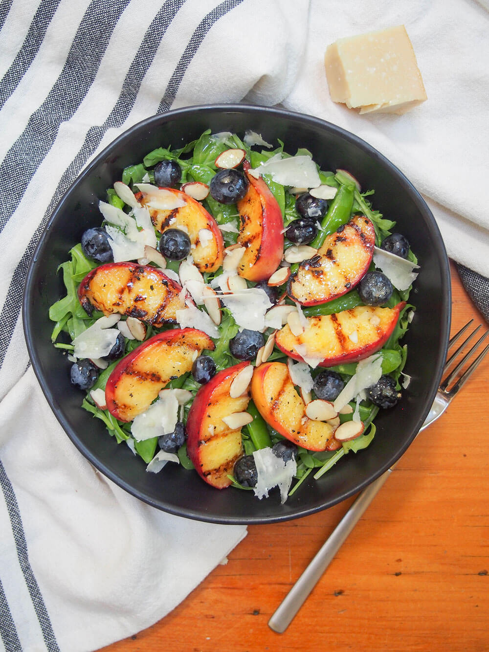 bowl of grilled peach salad from overhead