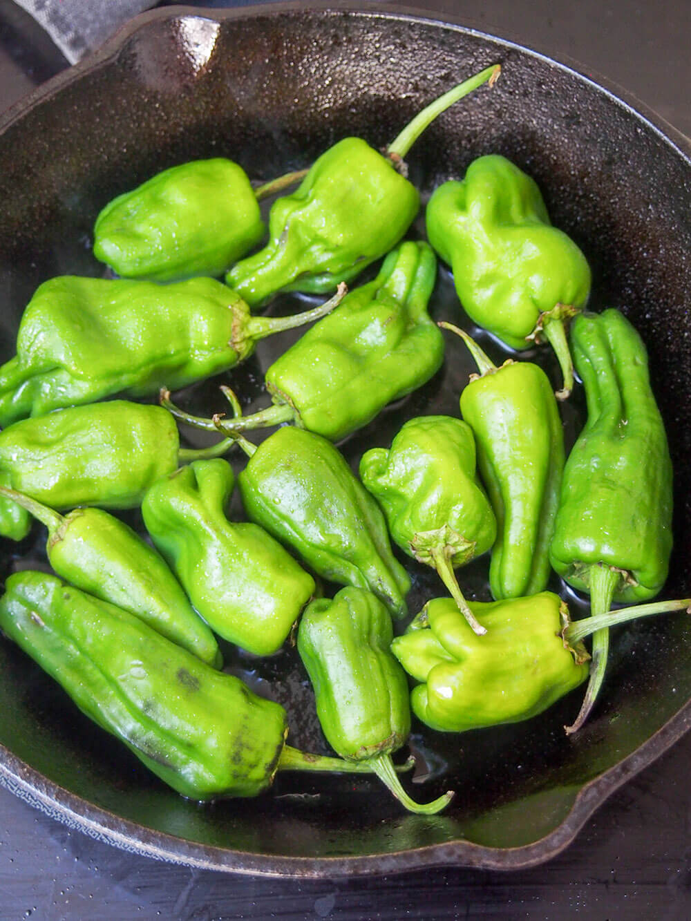 starting to cook Padron peppers