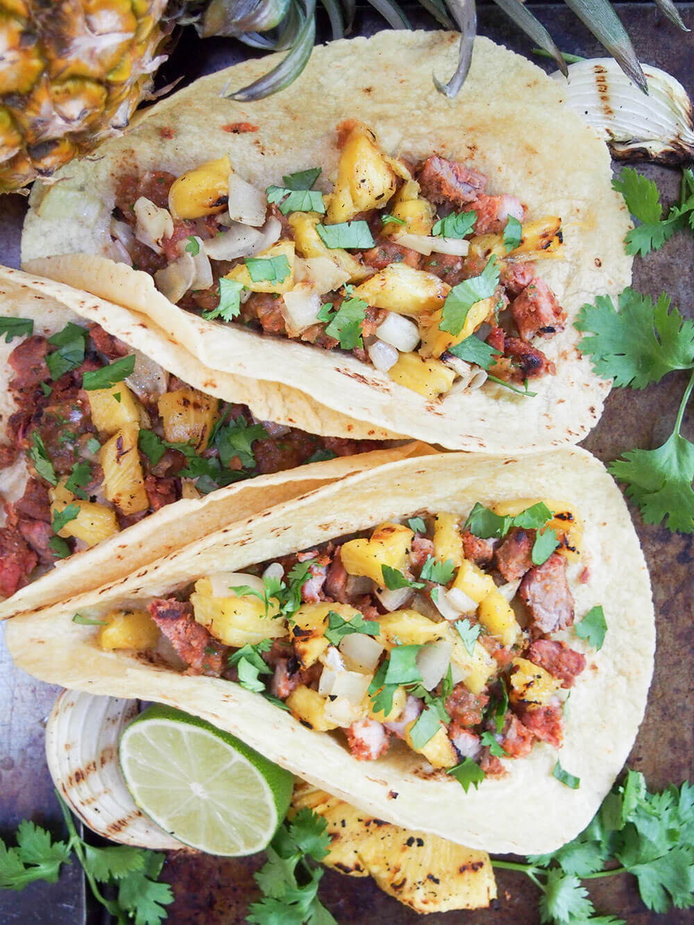 three tacos resting against each other from overhead