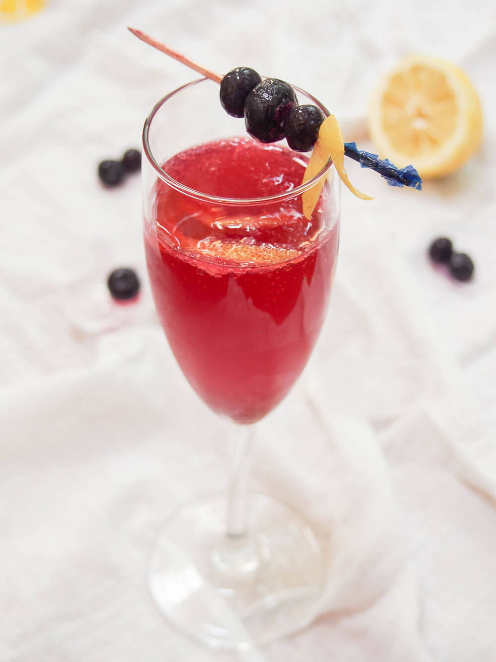 glass of blueberry French 75