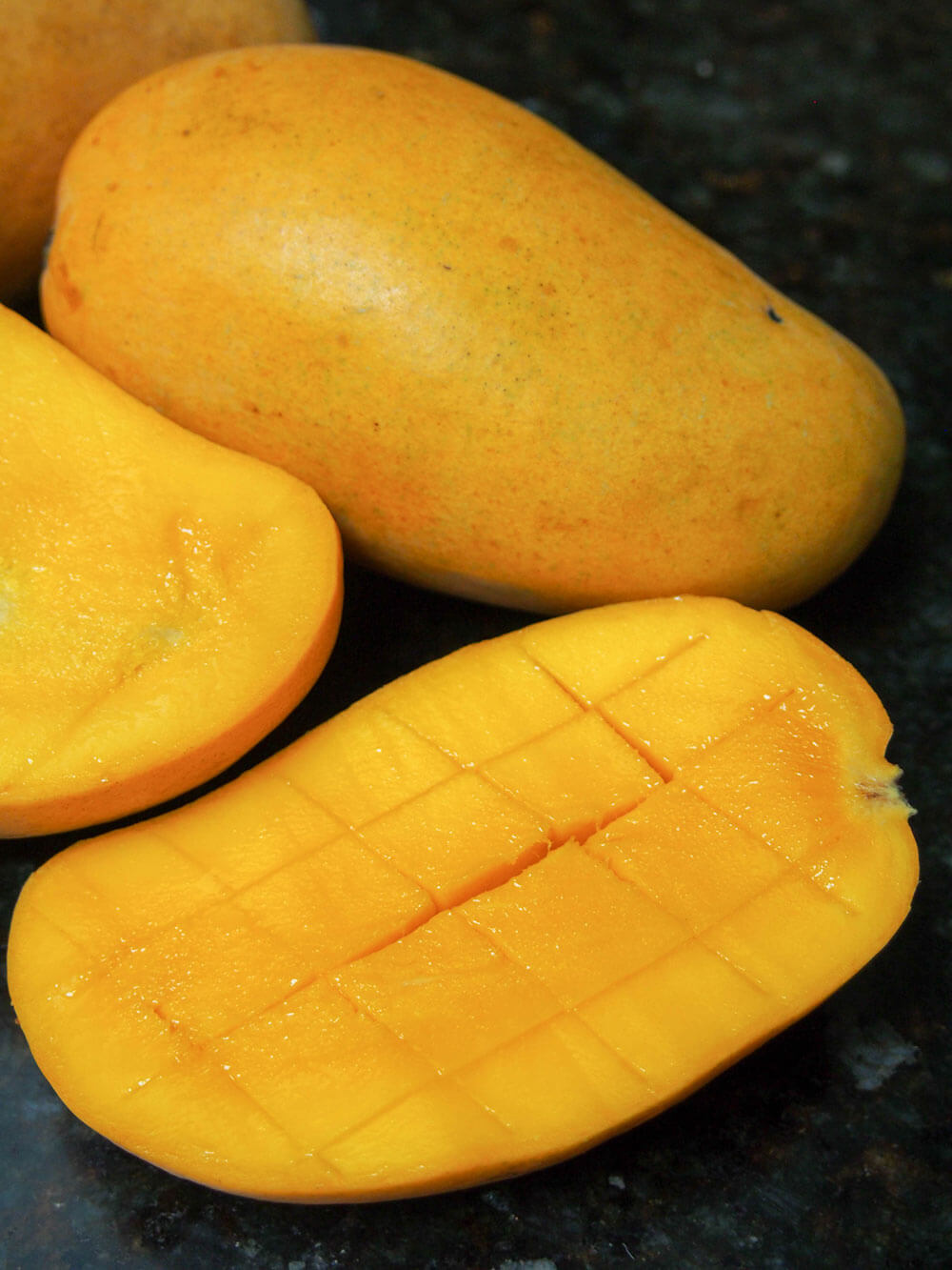 cutting mango for mango palatas (ice pops)
