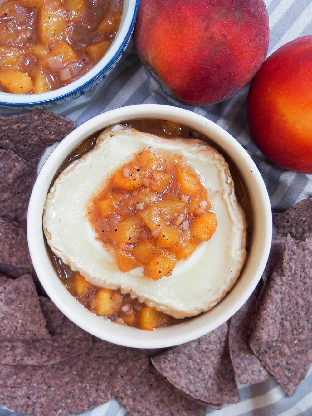 baked goat cheese with peach chutney on top and dish of chutney to side