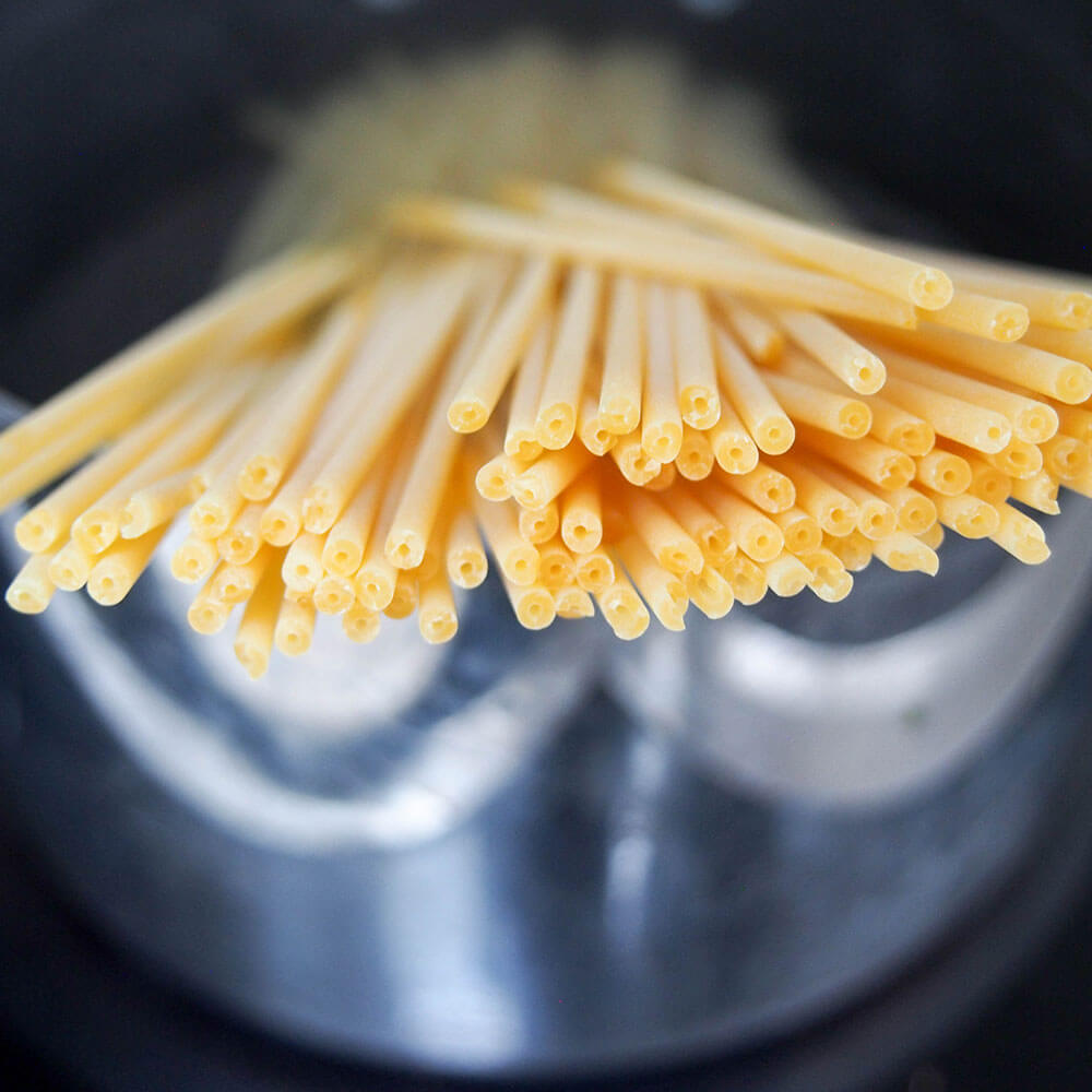 view of ends of pasta as they are in pan to start cooking