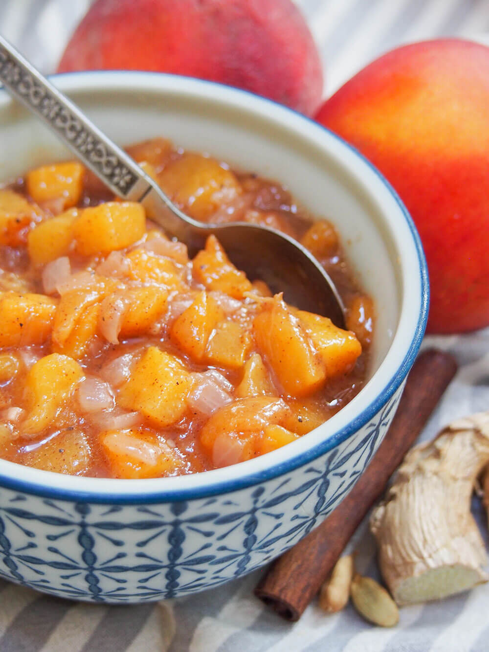 peach chutney close up of bowl with spoon in it