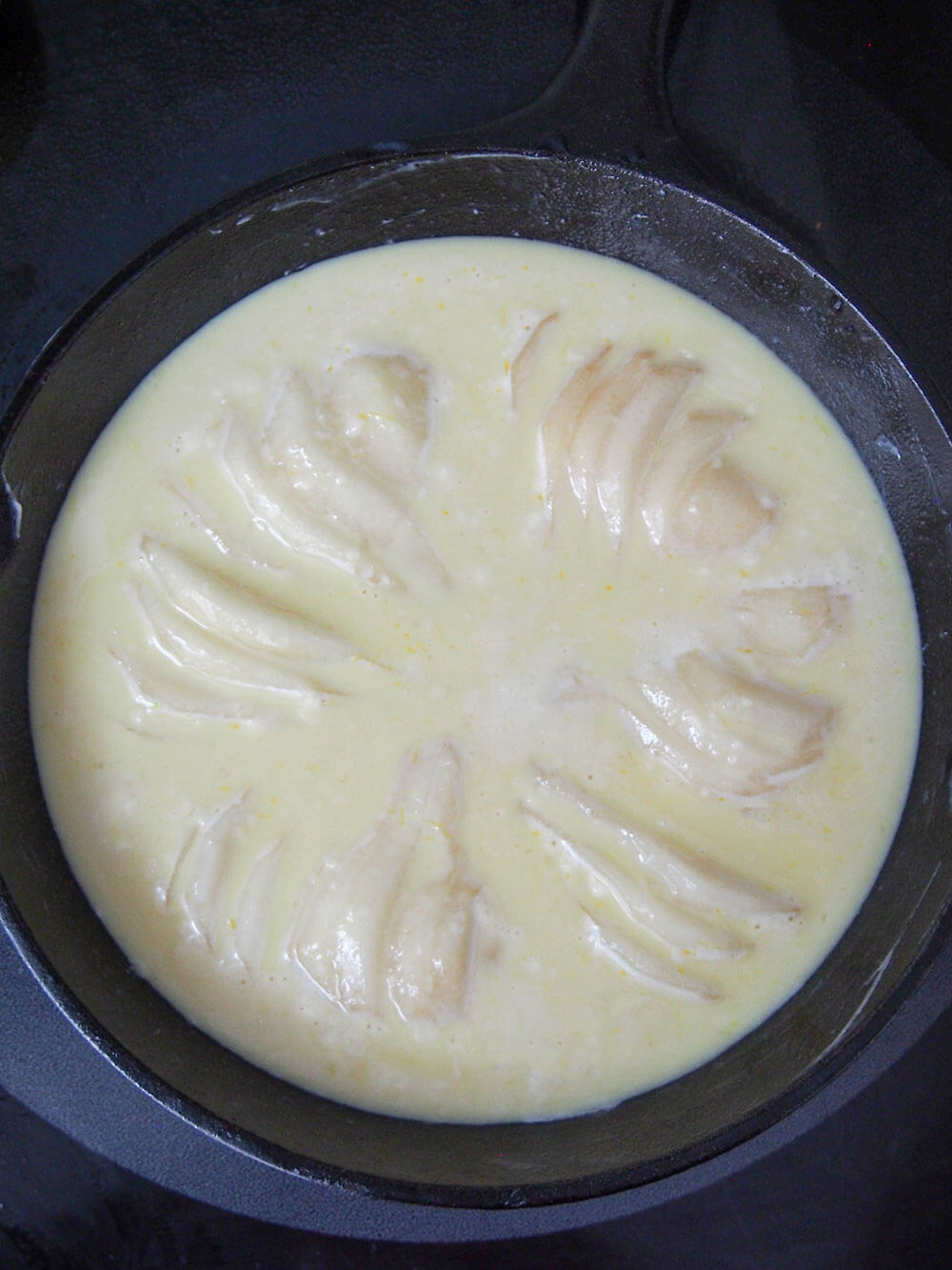 Pears in custard mixture ready to bake