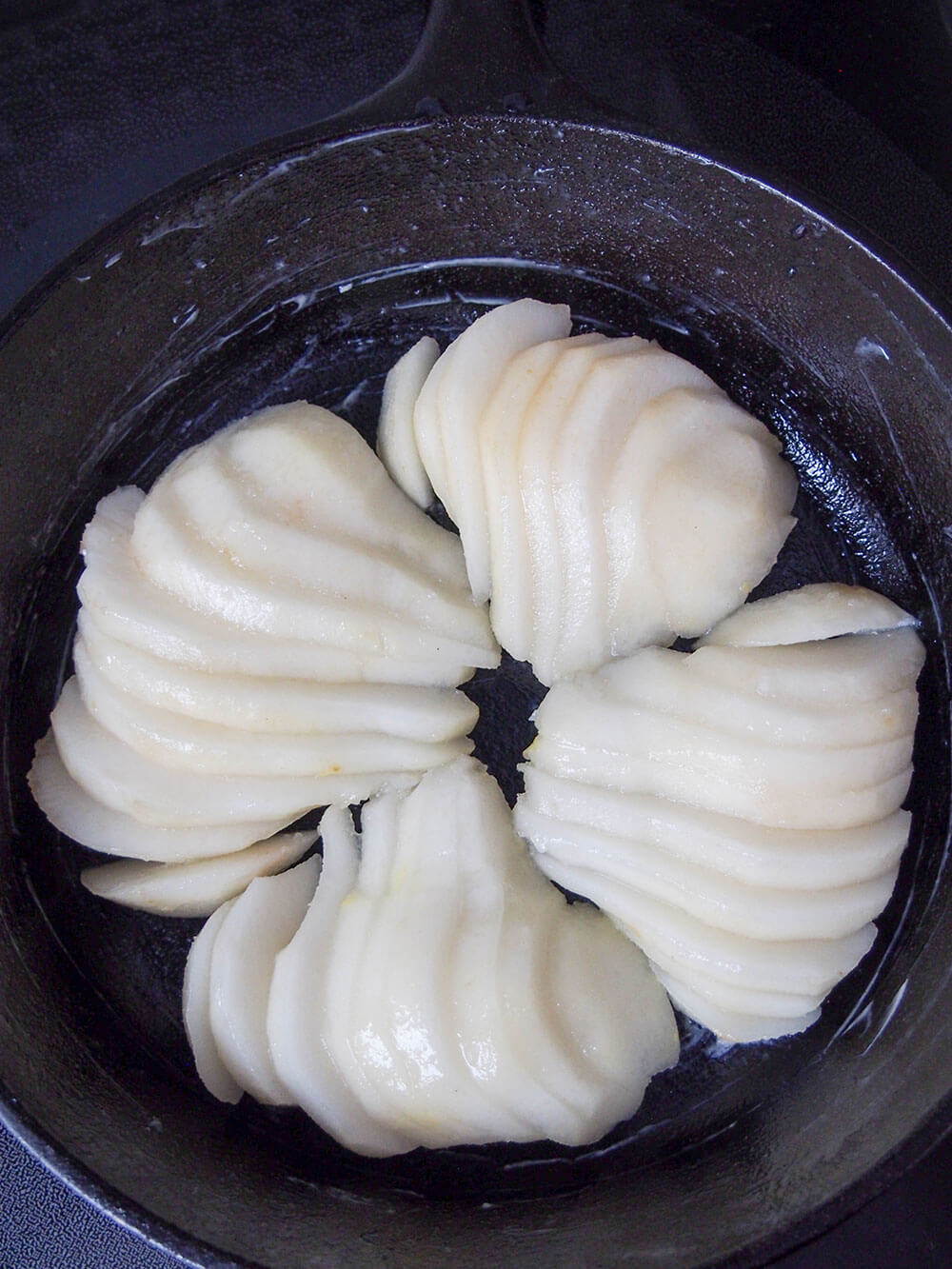 cut pears in skillet, with slices fanned out slightly
