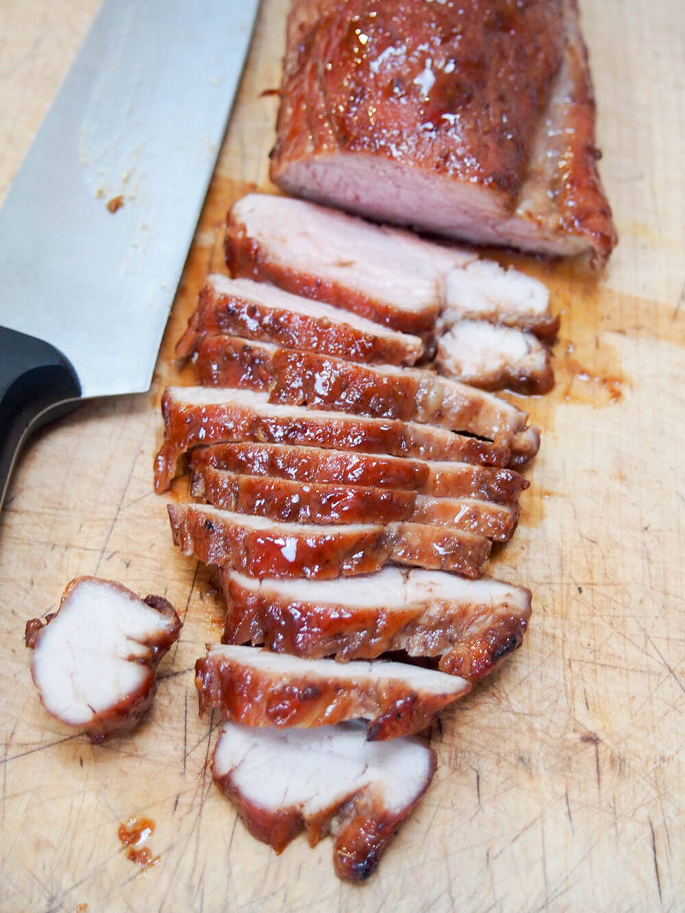 slicing pork for steamed bao buns with pork