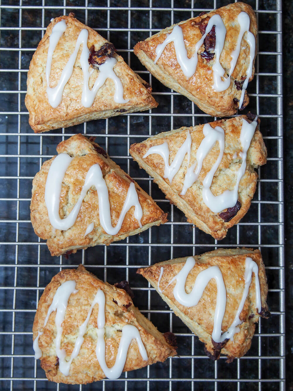 glazing cranberry orange scones viewed from overhead