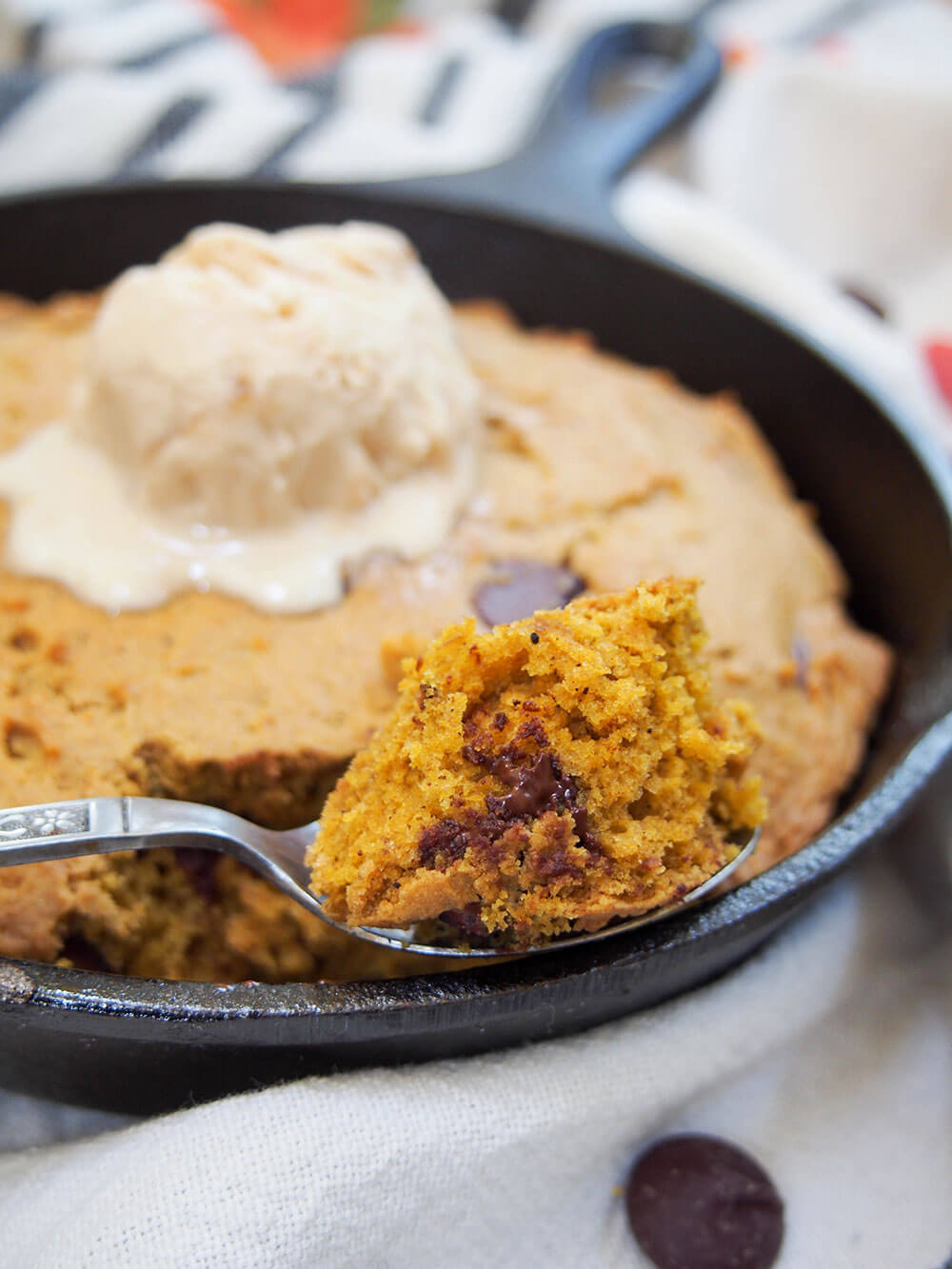 pumpkin mini skillet cookie with scoop of cookie on spoon