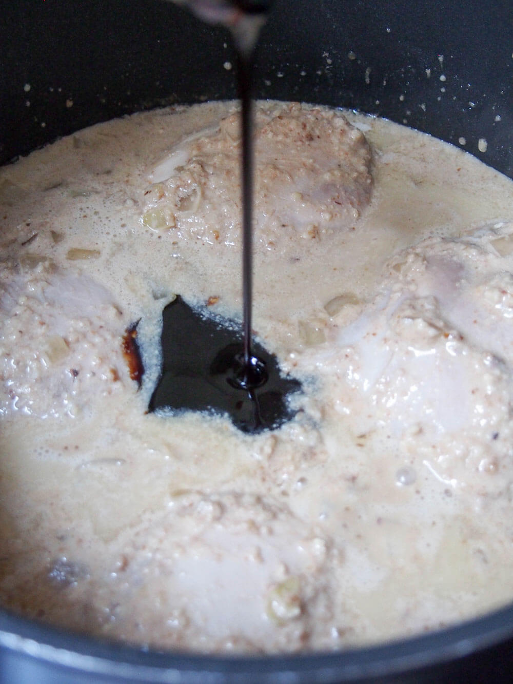 adding pomegranate molasses to stew