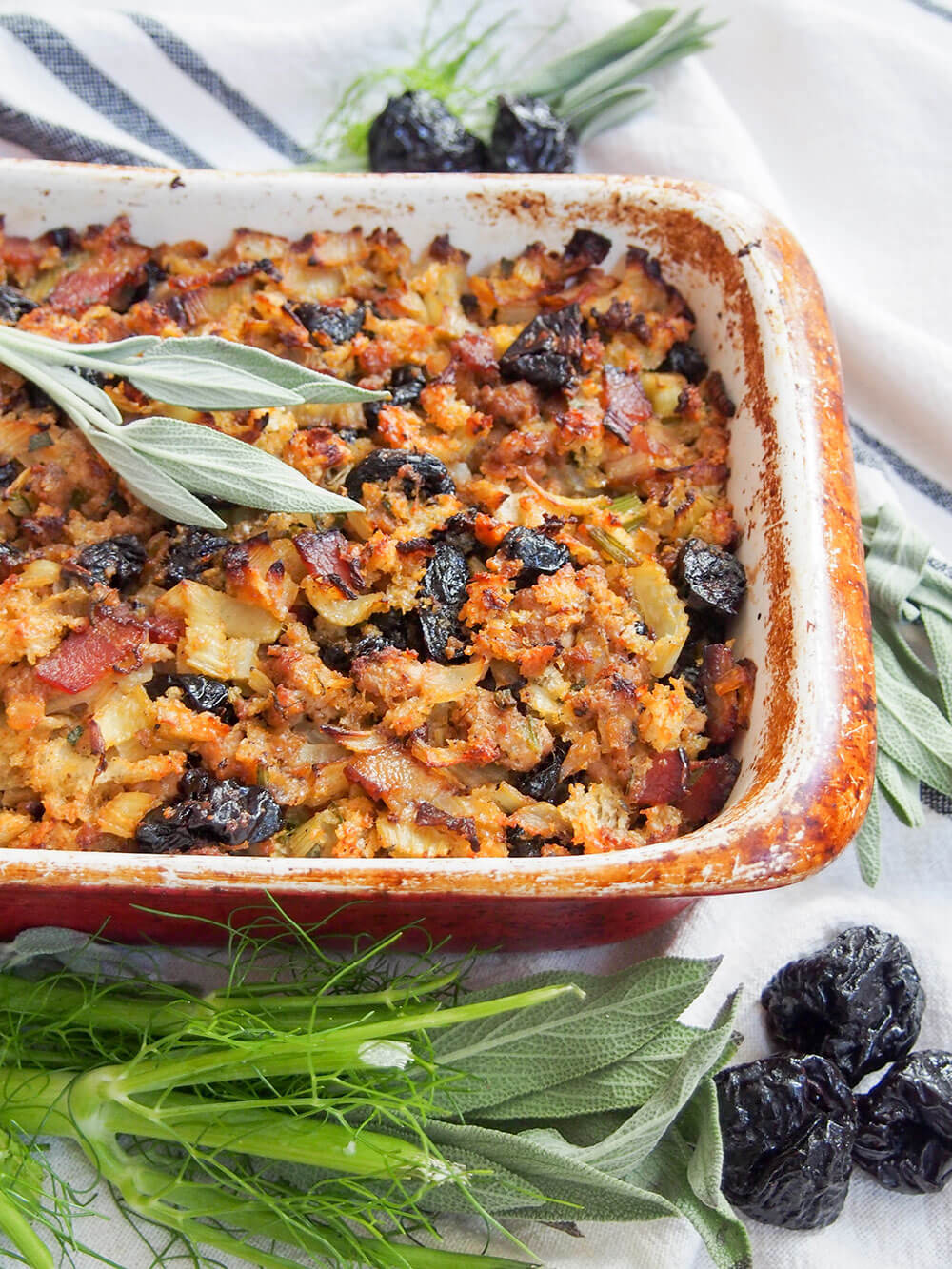 fennel, prune and pork stuffing with fennel, sage and prunes in front of dish