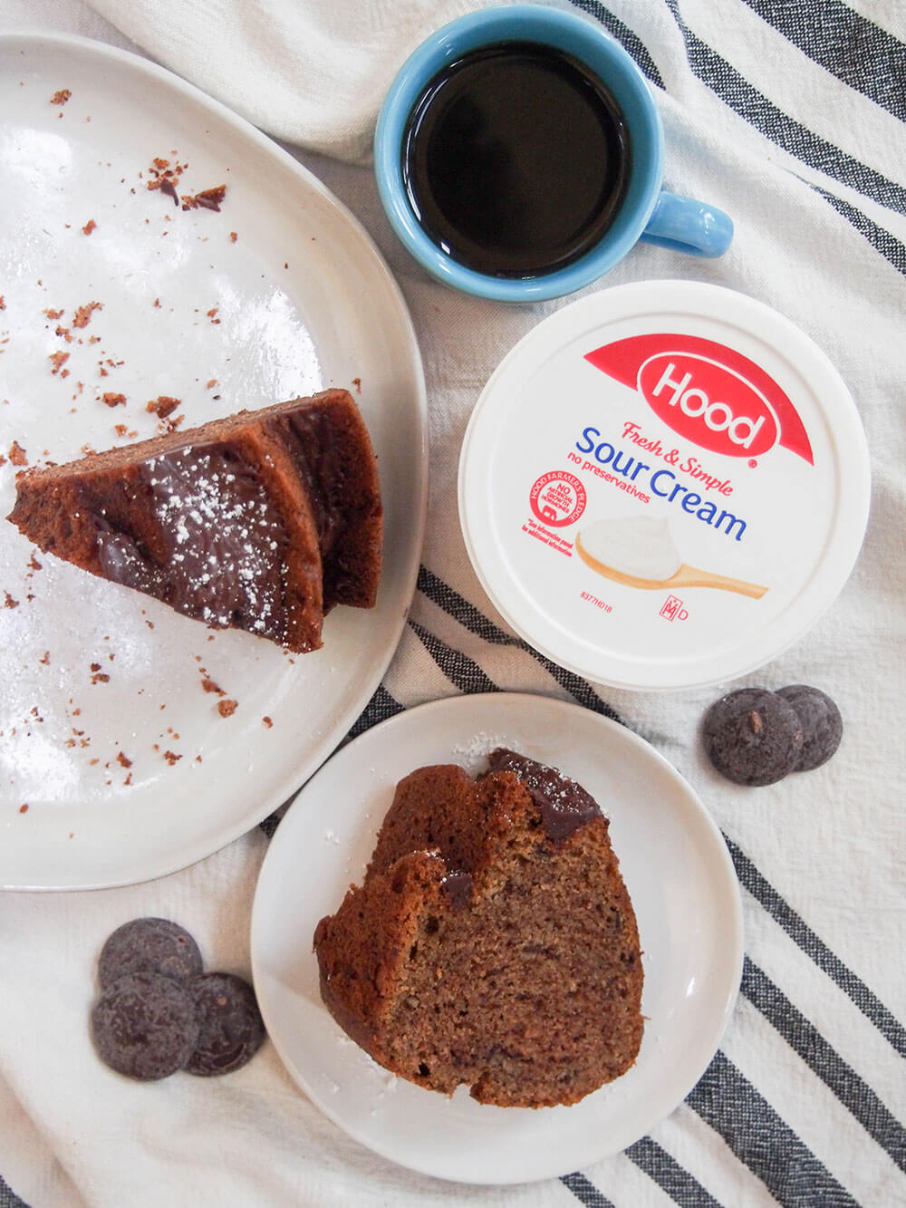 sour cream mocha cake is easy to make and great with coffee and tea slices of sour cream mocha cake on plates, one standing on end, one on side