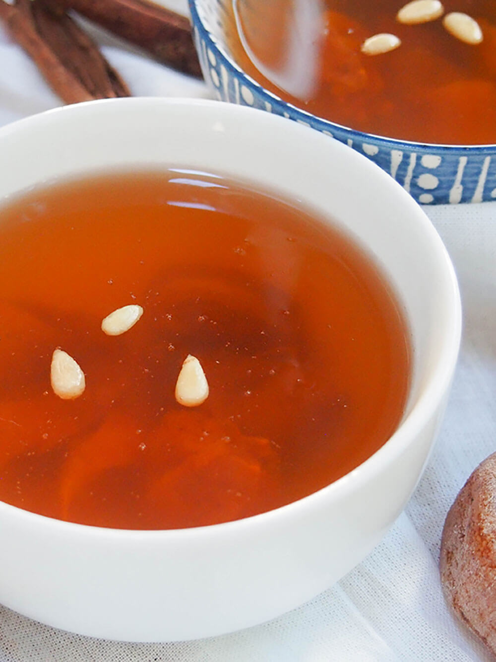 bowl of sujeonggwa (Korean ginger cinnamon tea) close up