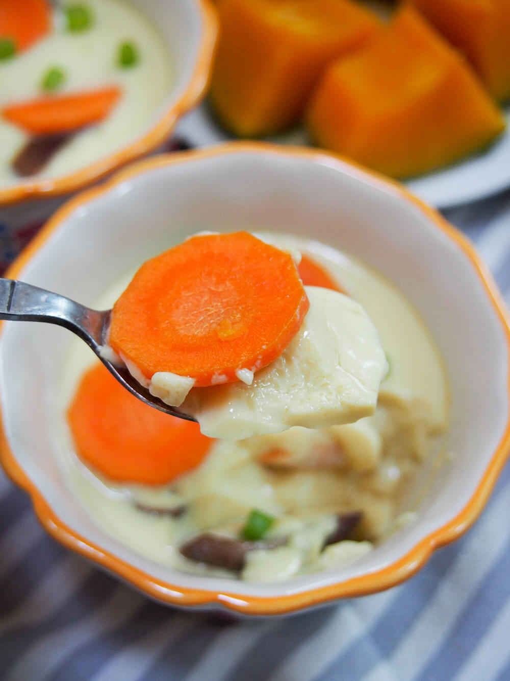 taking spoonful of chawanmushi from dish