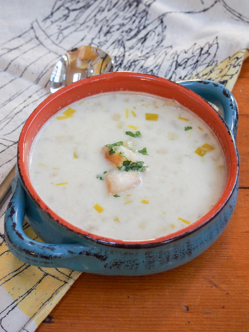 bowl of cullen skink - Scottish smoked haddock chowder - with spoon behind