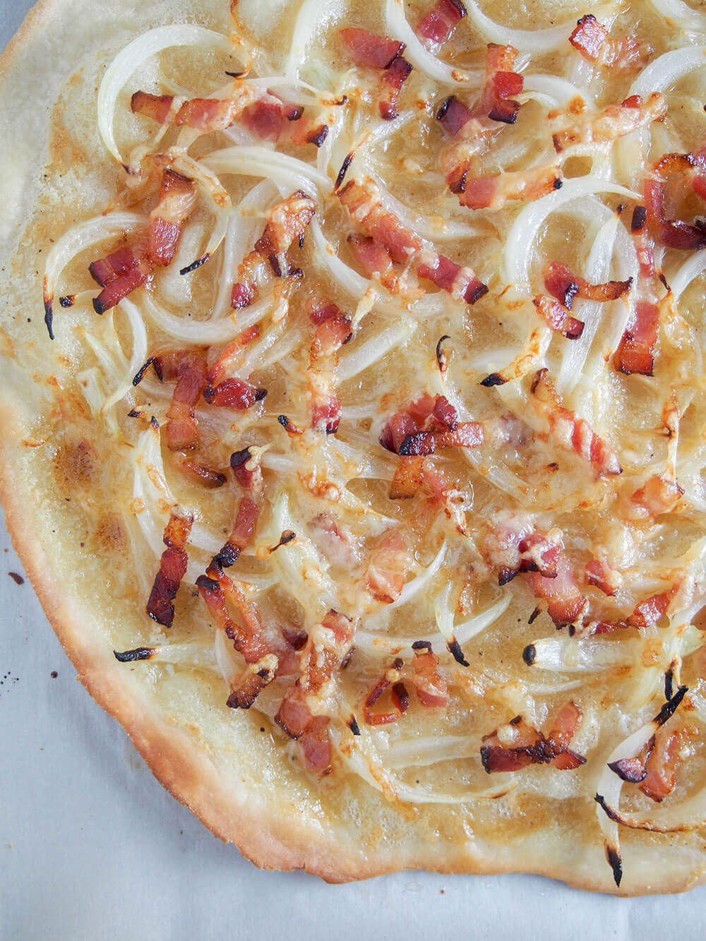 corner of flammekueche (tarte flambee from Alsace)