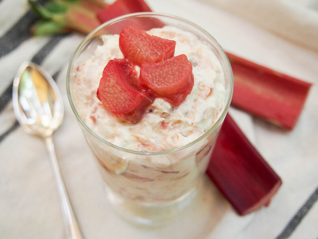 Rhubarb fool with rhubarb behind
