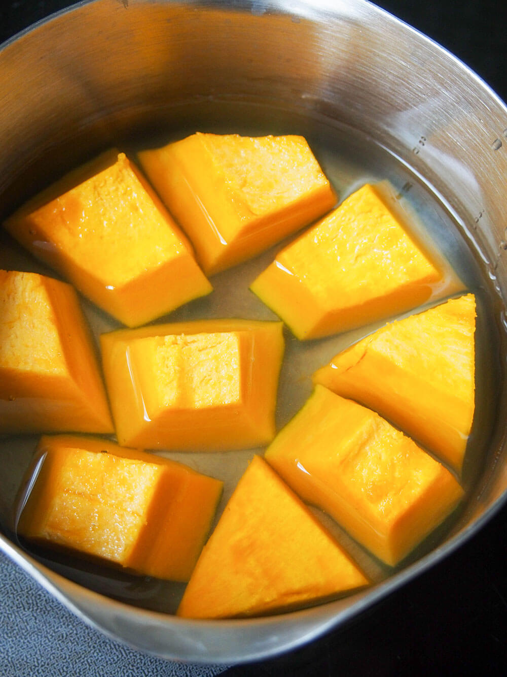 kabocha squash in dashi, ready to cook
