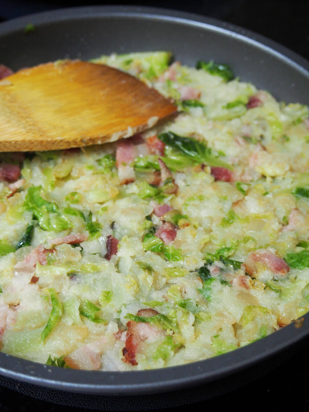patting mixture in to skillet to cook first side