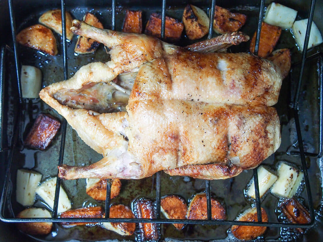 adding parsnips in with other vegetables under duck while it's roasting