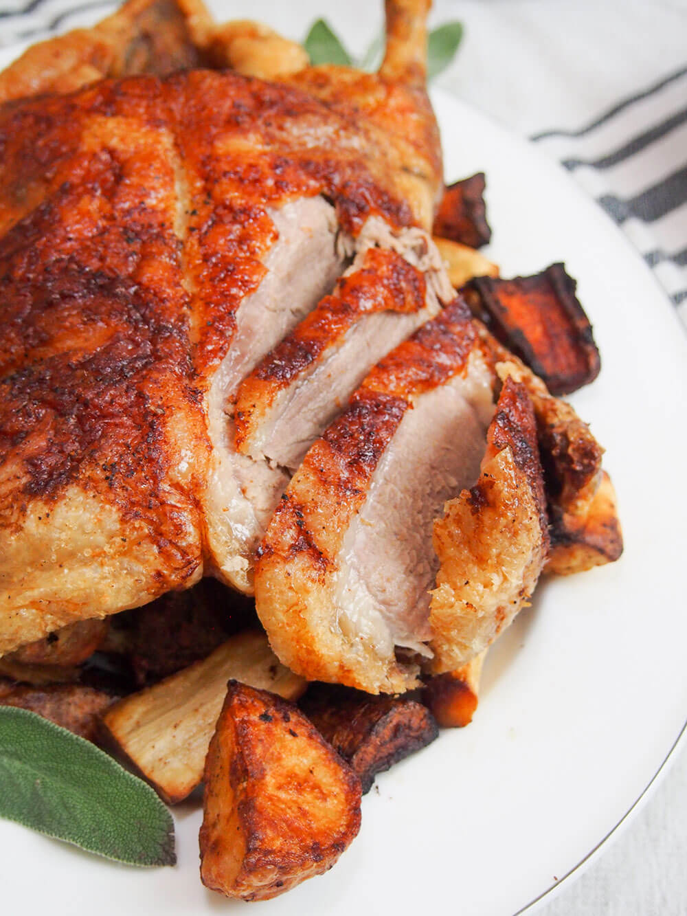 Slicing roast duck with vegetables around the side