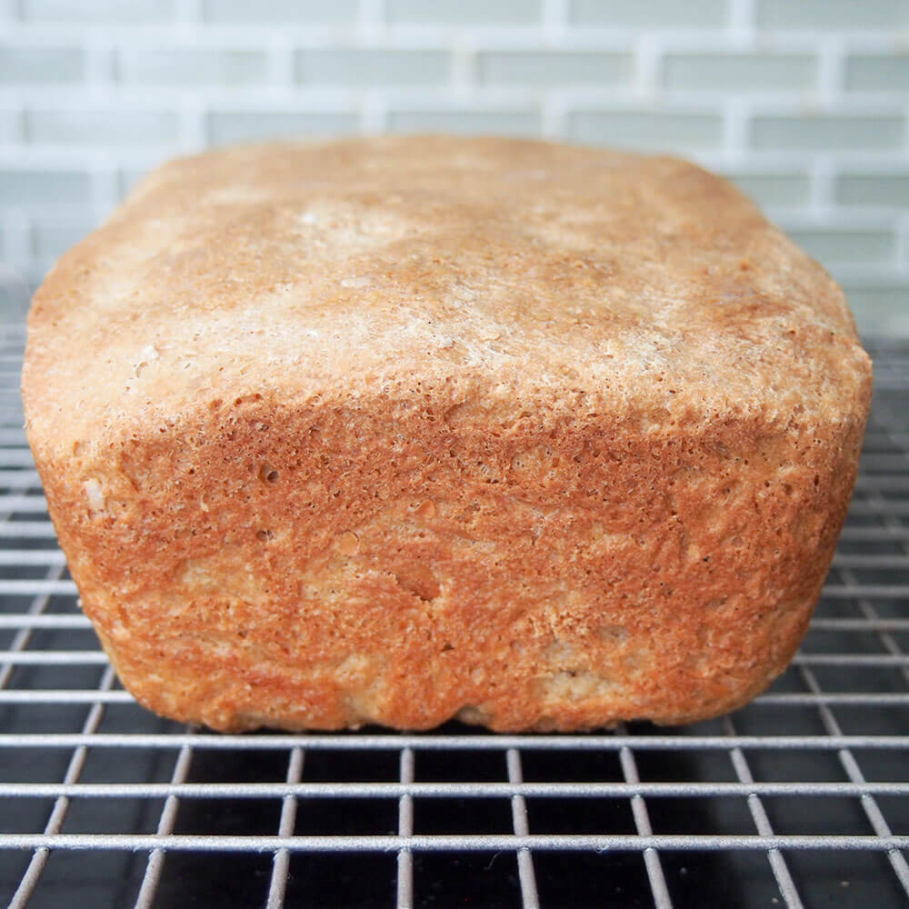 whole sprouted wheat bread cooling on rack
