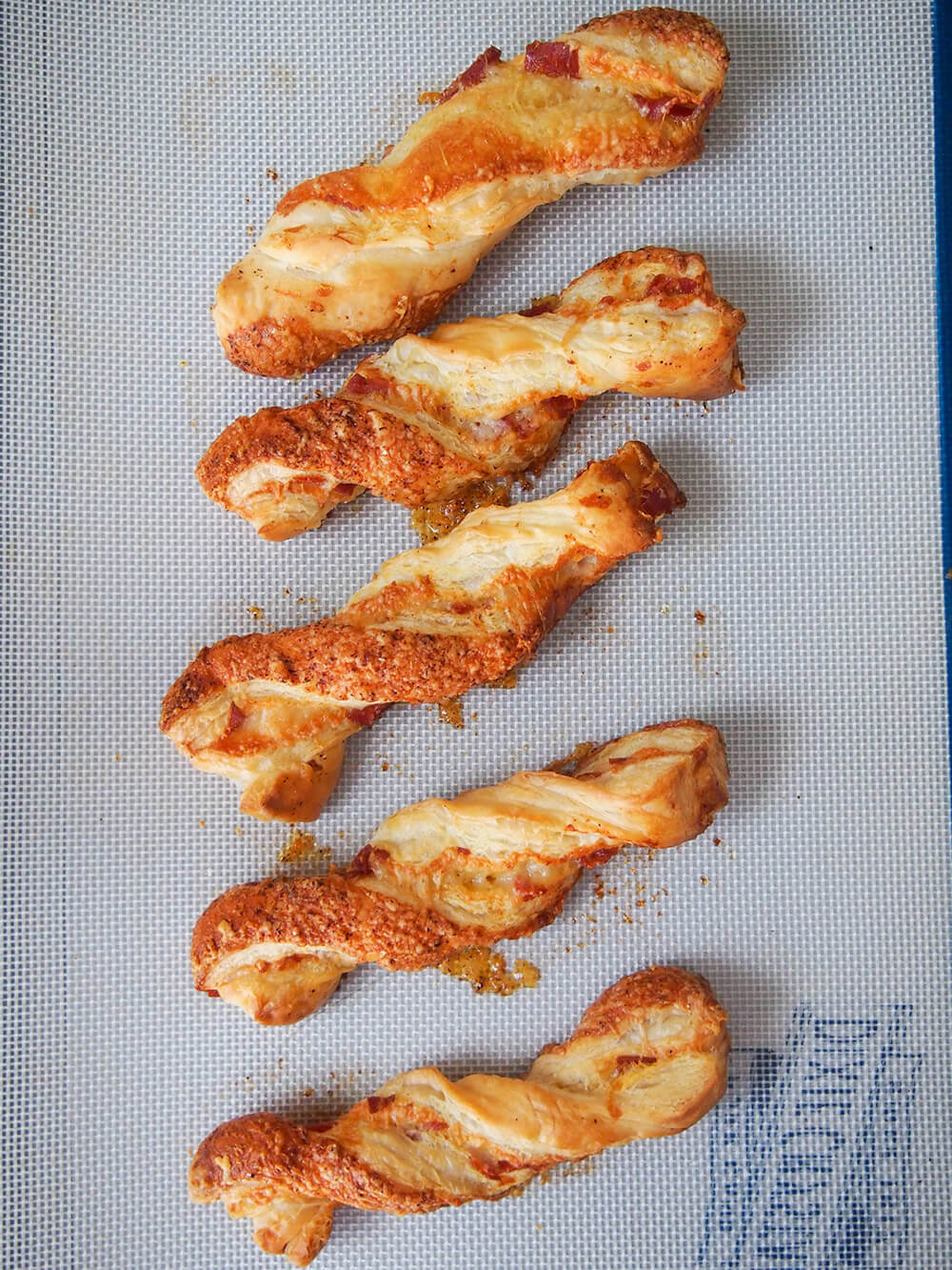baked chorizo cheese twists on baking sheet