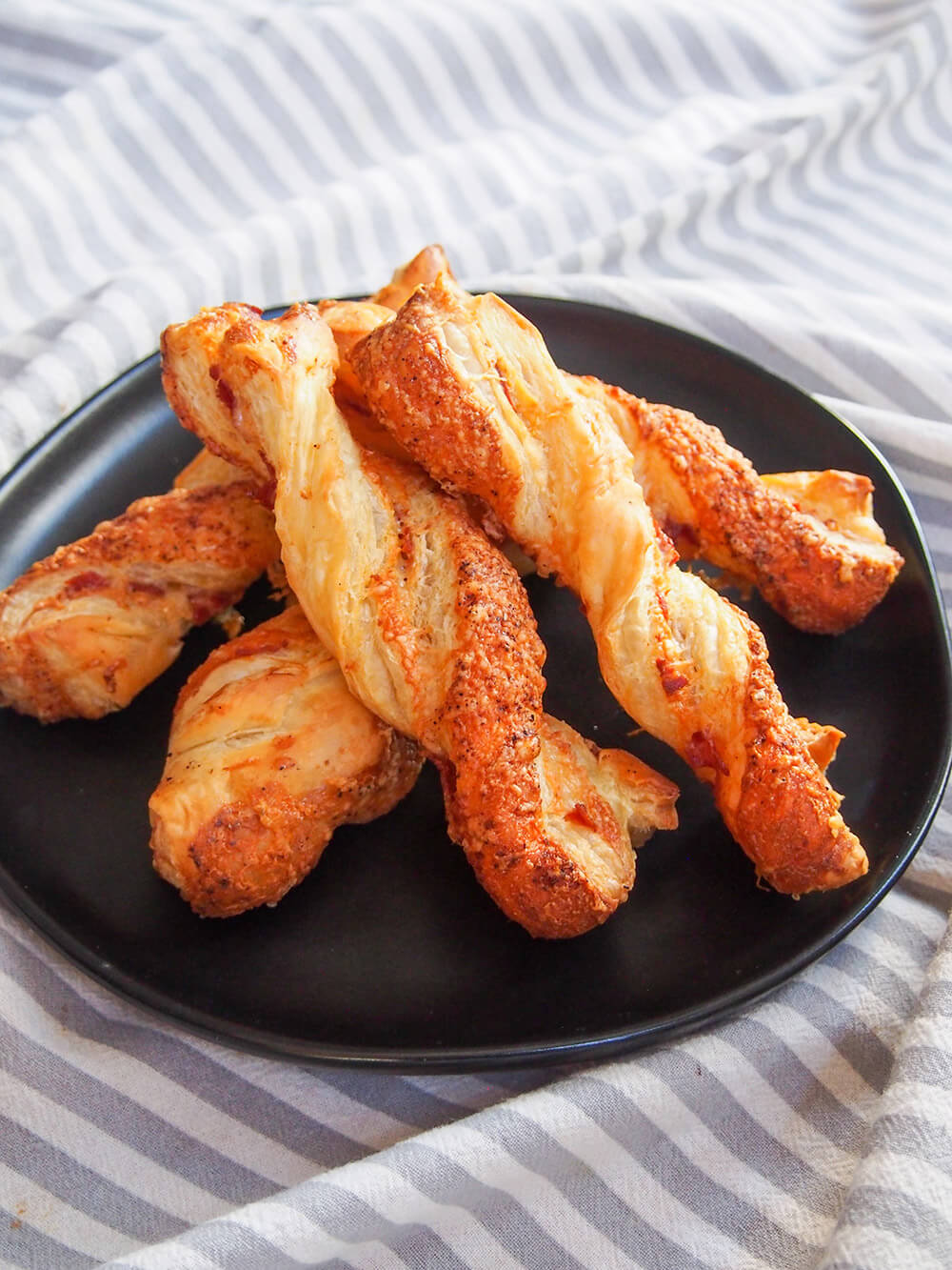 stack of chorizo cheese twists on plate