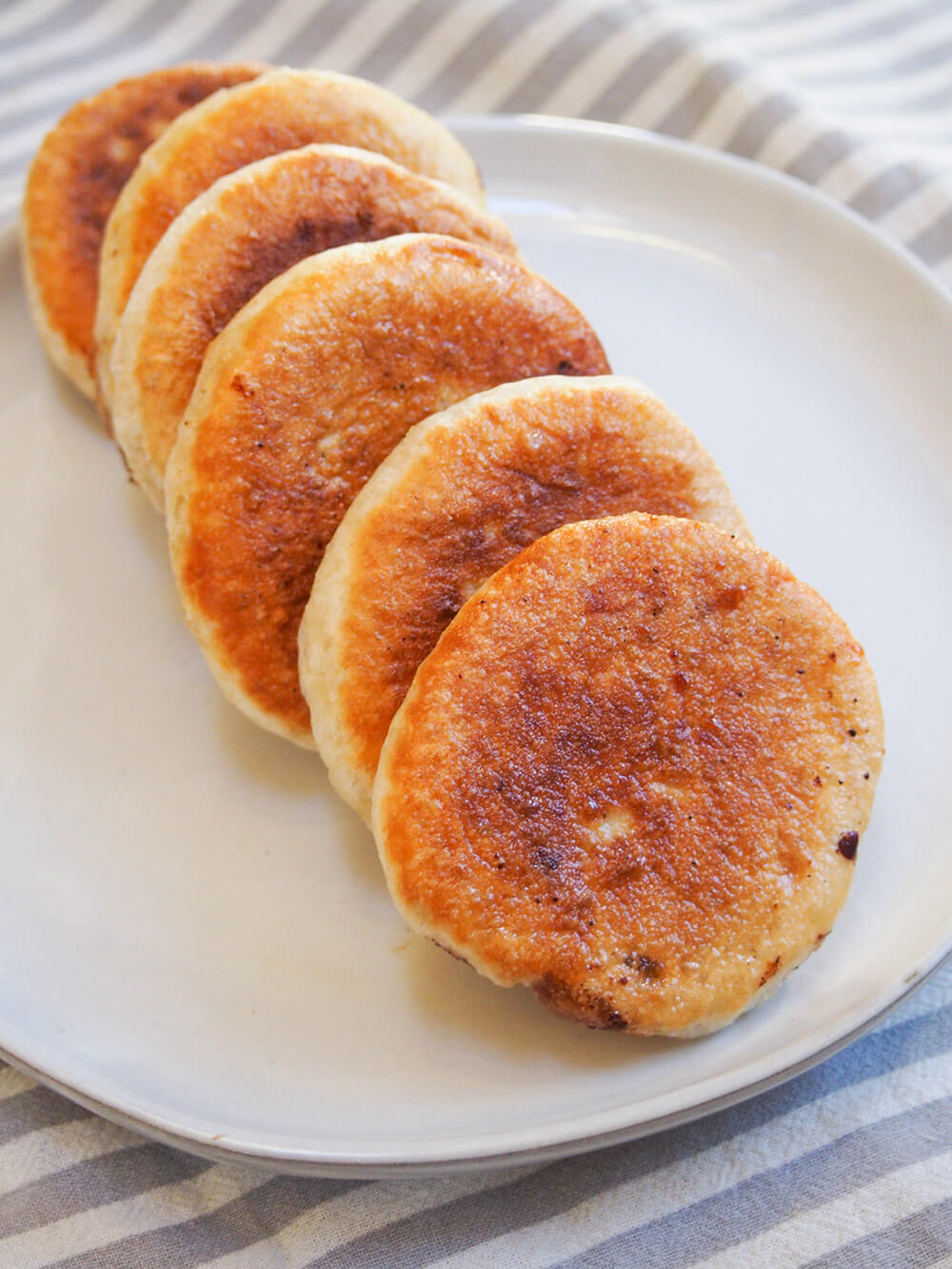 hotteok Korean sweet pancakes layed out in row on plate
