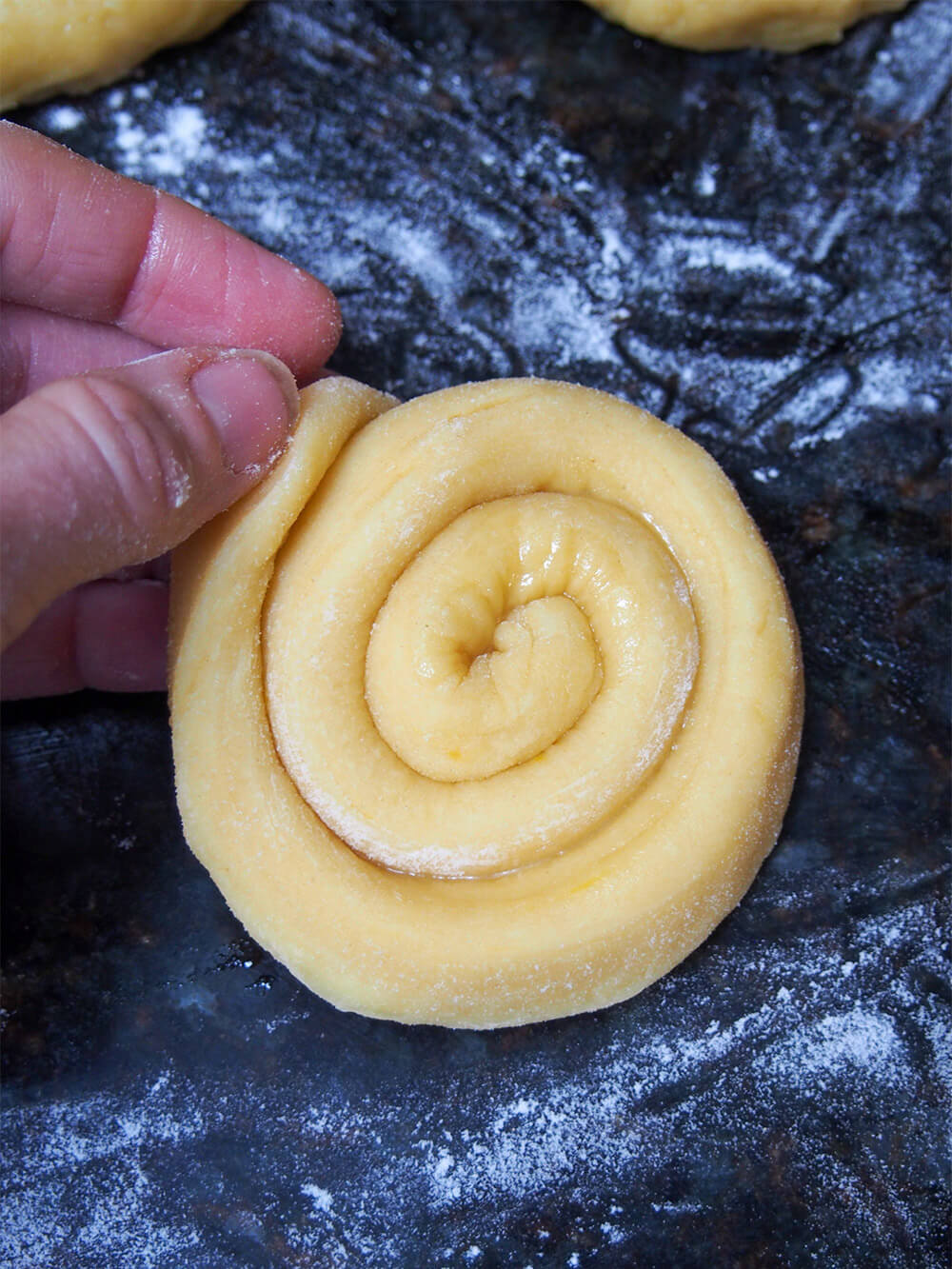 Tucking end of coil at end of forming roll