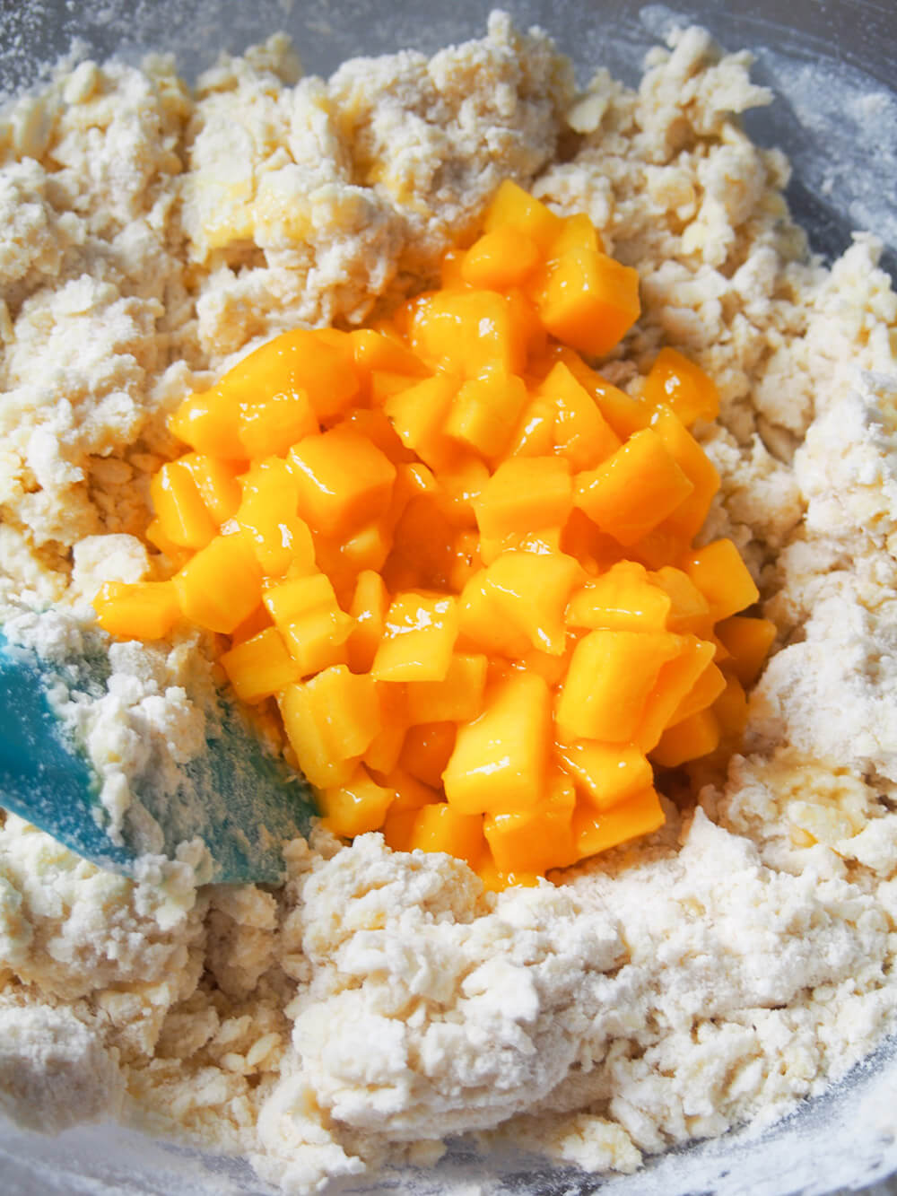 adding mango to coconut mango scone dough